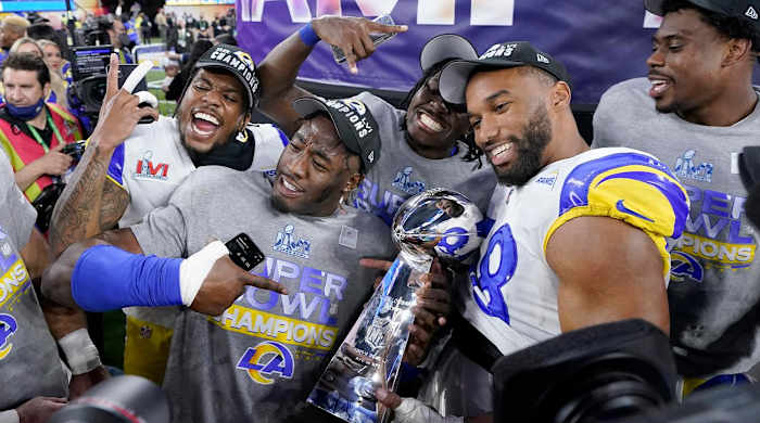 Los Angeles Rams players celebrate with the Lombardi Trophy after defeating the Cincinnati Bengals in the NFL Super Bowl 56 football game Sunday, Feb. 13, 2022, in Inglewood, Calif.